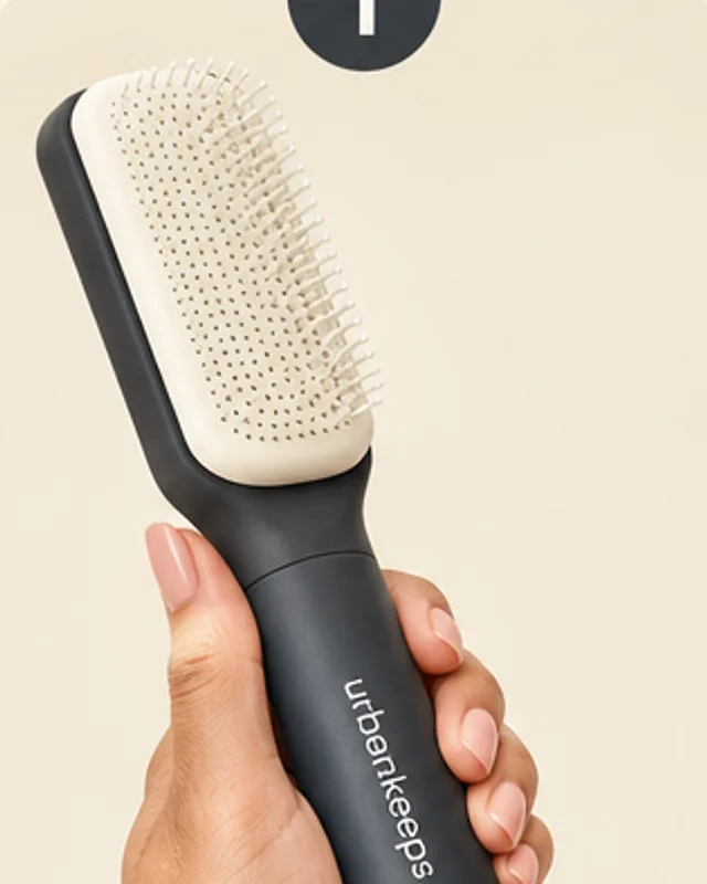 TwistClean Self-Cleaning Hair Brush: step 1, Twist